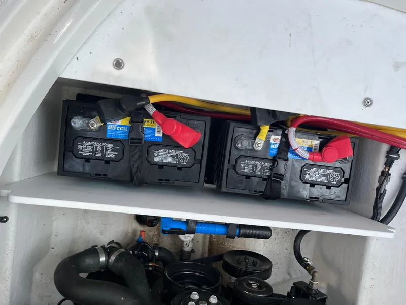 Slide: The Image of 2021 Monterey M6 boat battery compartment with dual deep cycle batteries and wiring. - 10