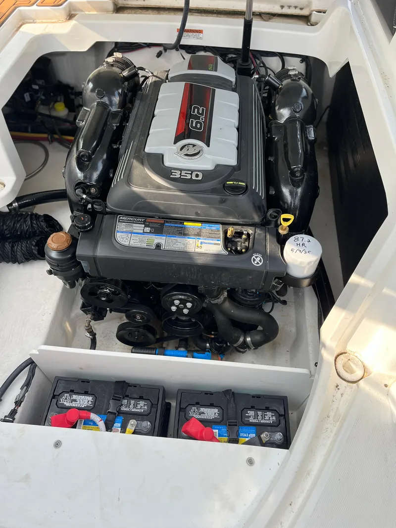 Slide: The Image of 2021 Monterey M6 boat engine compartment with 6.2L 350 horsepower engine and batteries. - 9