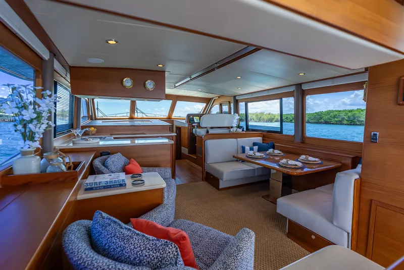 Slide: The Image of Luxurious interior of 2018 Grand Banks GB60 yacht with elegant dining area and scenic ocean views. - 28