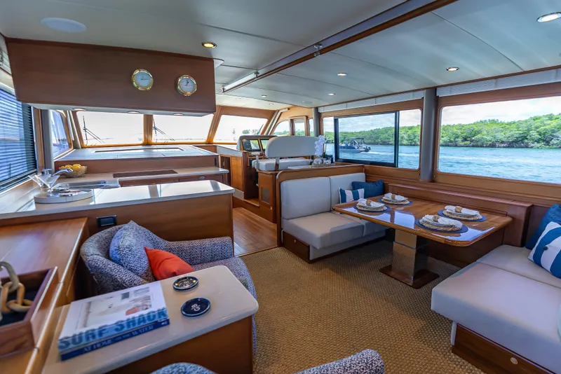 Slide: The Image of Luxurious interior of 2018 Grand Banks GB60 yacht with elegant dining area and scenic views. - 31