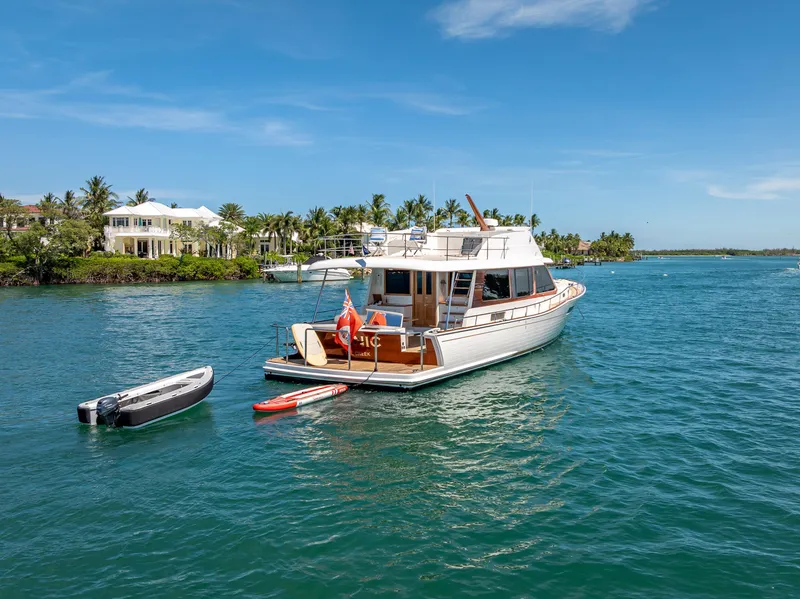 Slide: The Image of 2018 Grand Banks GB60 yacht anchored in scenic tropical waters. - 5