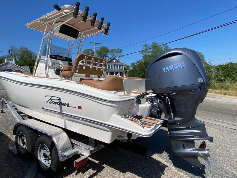 Slide: The Image of 2025 Pioneer 202 Islander boat dashboard with Garmin navigation system and steering wheel. - 4