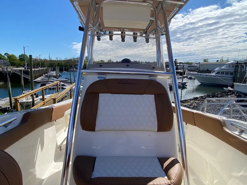 Slide: The Image of 2025 Pioneer 202 Islander boat with brown leather seating and Yamaha engine. - 8