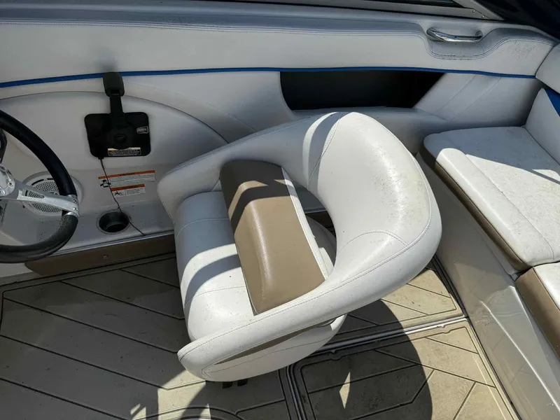 Slide: The Image of 2008 Four Winns 200 Horizon boat interior with white seating and steering wheel. - 14