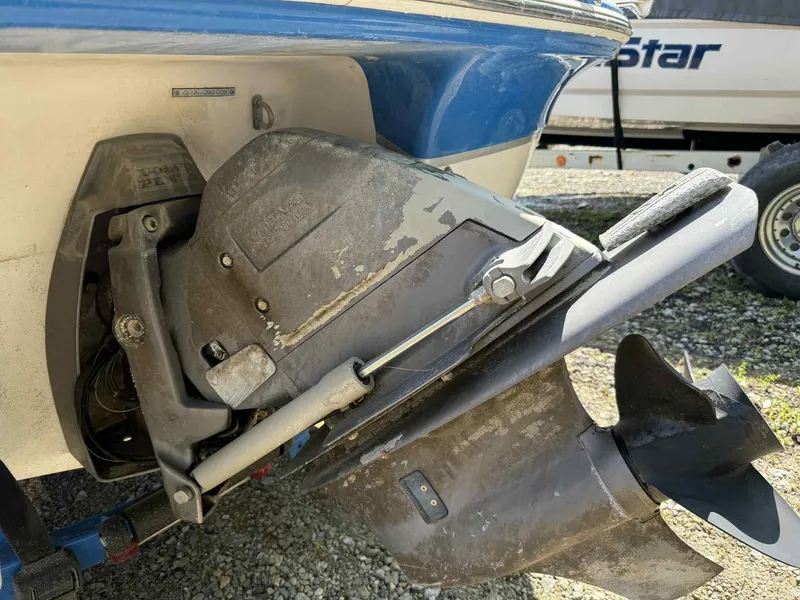 Slide: The Image of 2008 Four Winns 200 Horizon boat outdrive, showing propeller and engine components. - 19