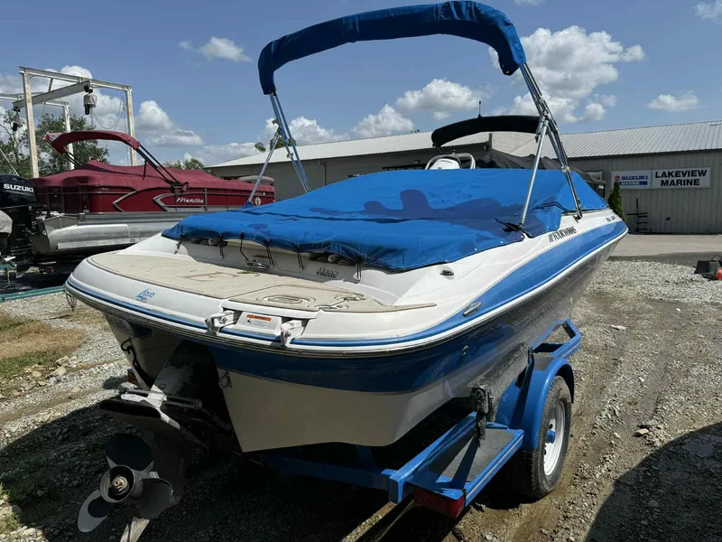 Slide: The Image of 2008 Four Winns 200 Horizon boat with blue cover on trailer at Lakeview Marine. - 3