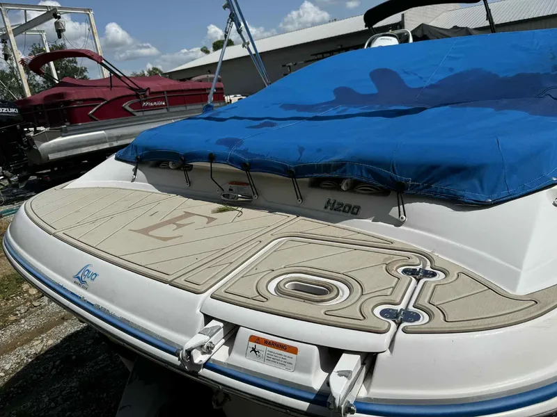 Slide: The Image of 2008 Four Winns 200 Horizon boat with blue cover and Aqua traction deck. - 4