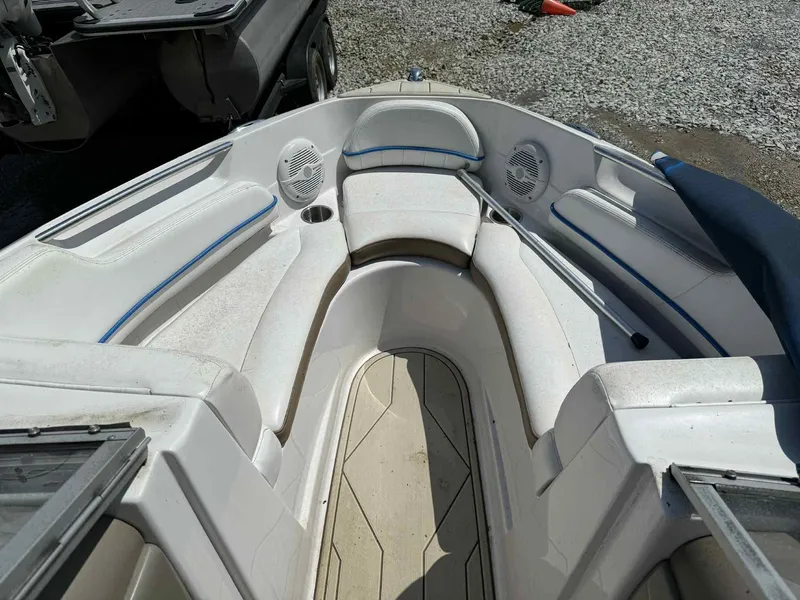 Slide: The Image of 2008 Four Winns 200 Horizon boat interior with white seating and blue accents. - 6