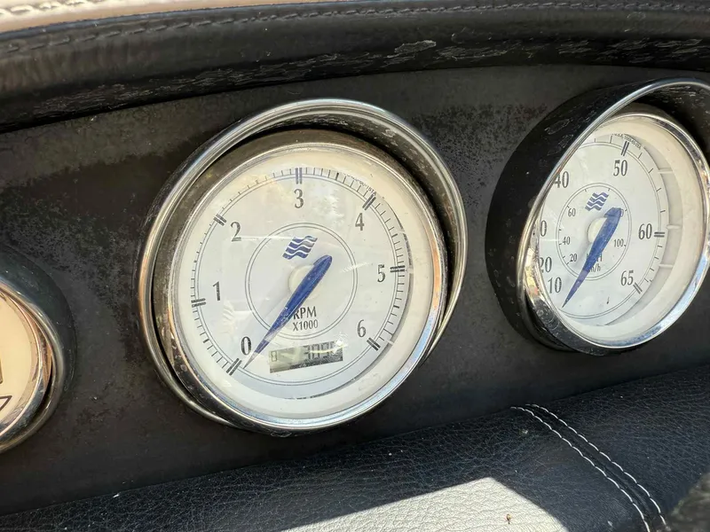 Slide: The Image of Dashboard gauges of a 2008 Four Winns 200 Horizon boat, showing RPM and speed. - 8