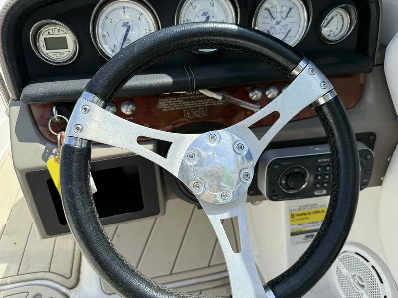 Slide: The Image of Steering wheel and dashboard of 2008 Four Winns 200 Horizon boat. - 9