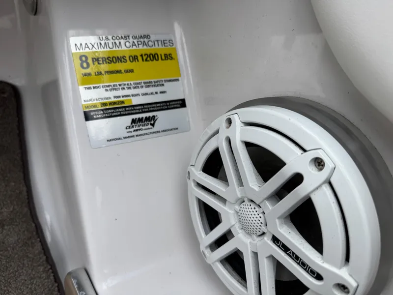 Slide: The Image of 2008 Four Winns H200 boat capacity label and JL Audio speaker. - 11