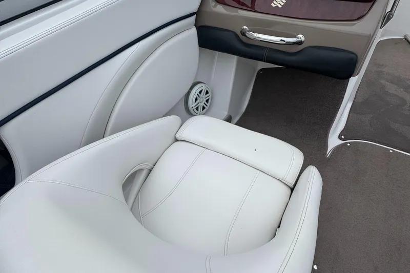Slide: The Image of 2008 Four Winns H200 boat interior with white seating and dashboard details. - 15