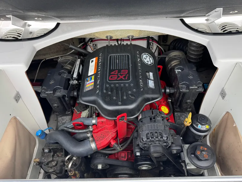 Slide: The Image of Engine compartment of a 2008 Four Winns H200 boat, featuring a Volvo Penta 4.3 GXI engine. - 8