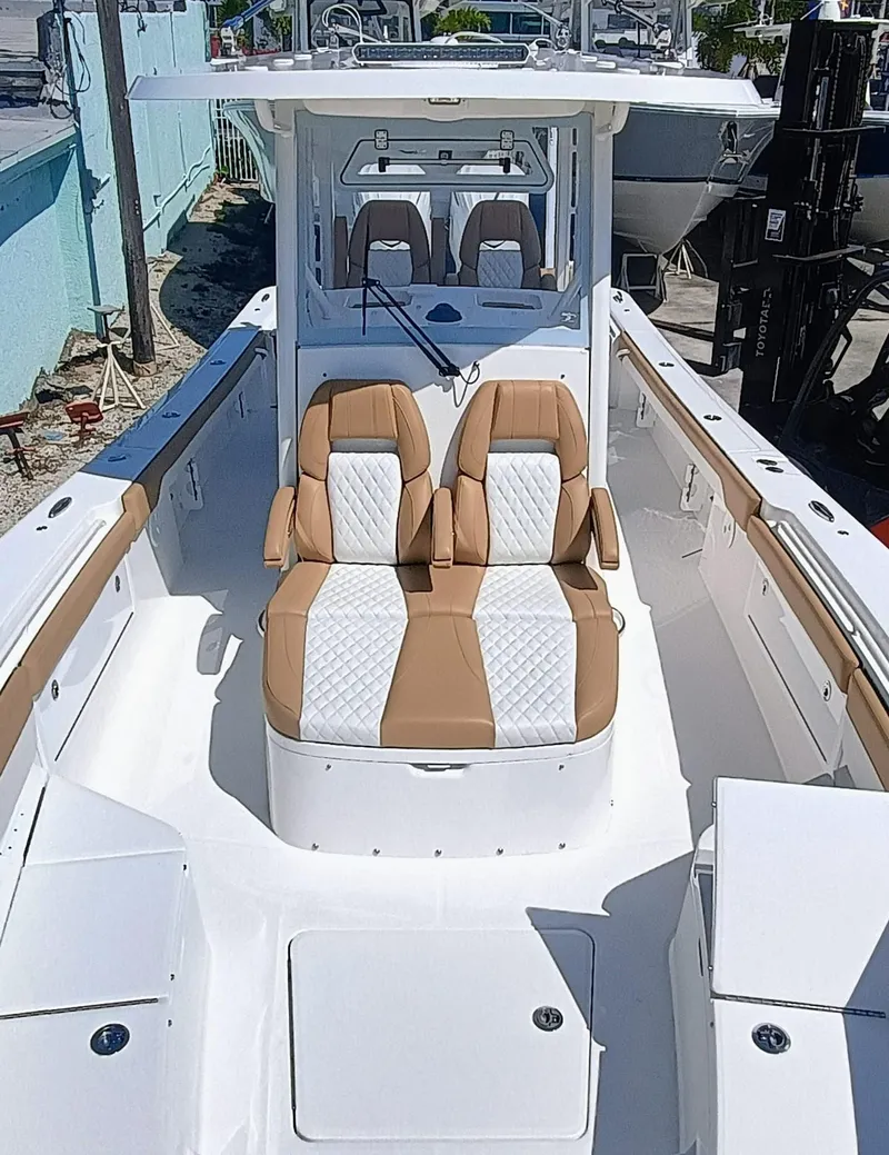 Slide: The Image of 2025 Regulator 30XO boat interior with tan and white seating, showcasing modern design. - 7