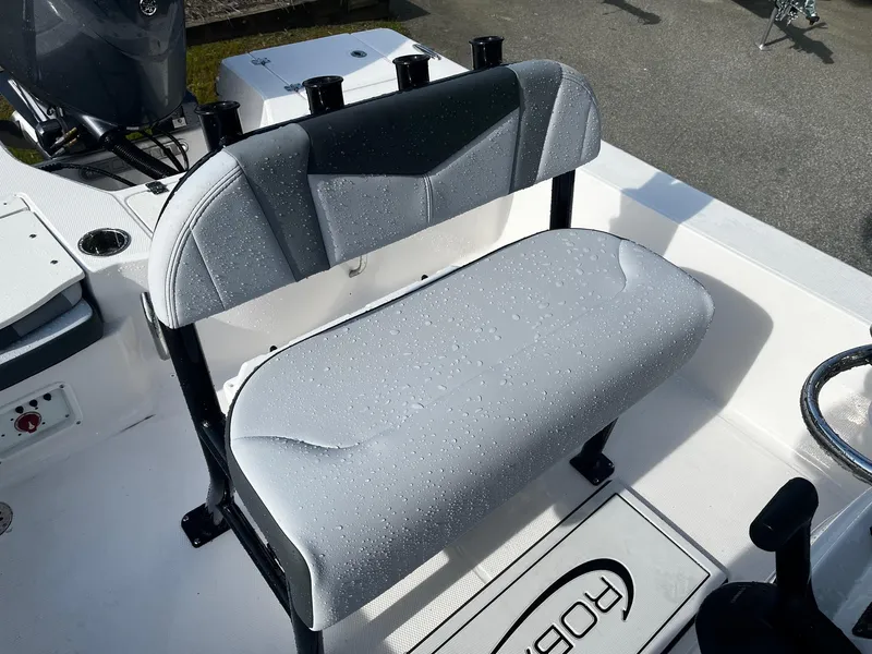 Slide: The Image of 2025 Robalo 206 Cayman boat seat with water droplets, showcasing sleek design and comfort. - 18