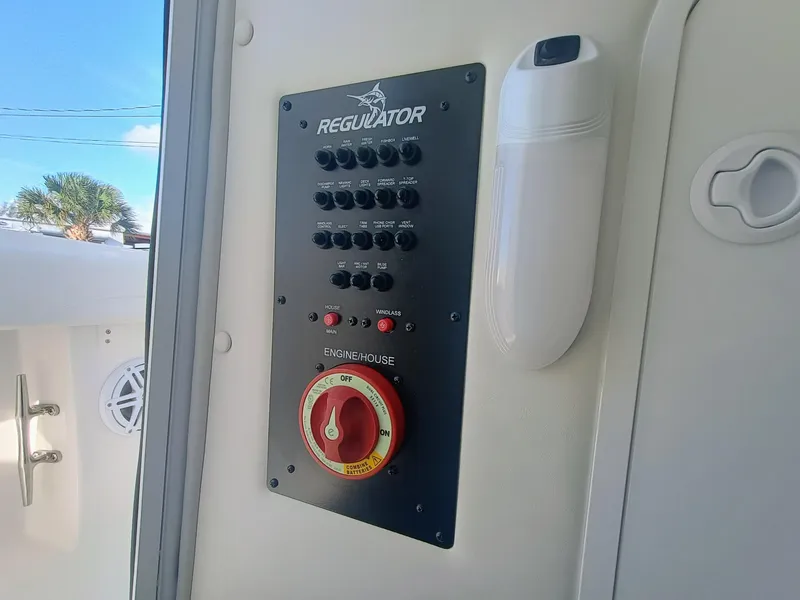 Slide: The Image of Control panel of 2025 Regulator 23 boat with switches and battery selector. - 11