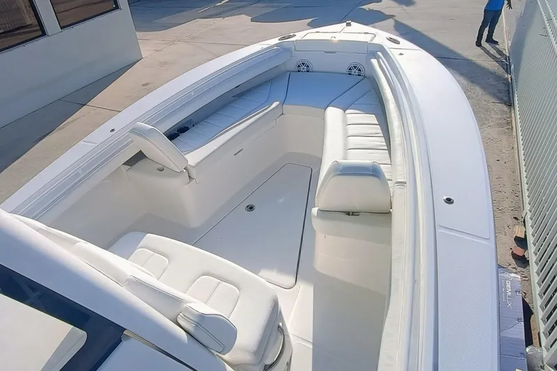 Slide: The Image of 2025 Regulator 23 boat with spacious white seating and modern design. - 13