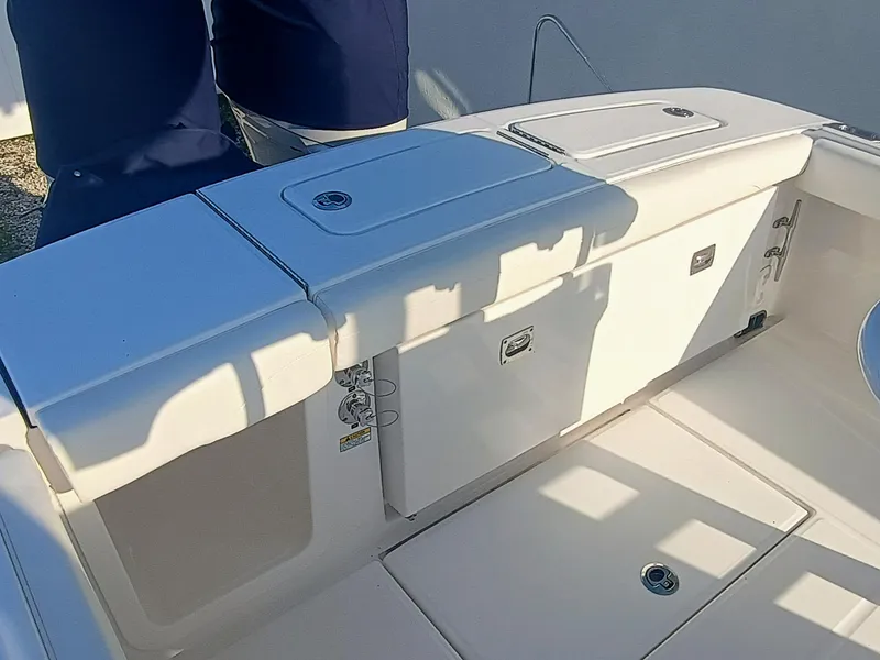 Slide: The Image of 2025 Regulator 23 boat interior with storage compartments and seating area. - 30