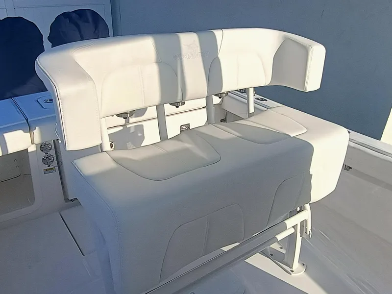 Slide: The Image of 2025 Regulator 23 boat seating with white upholstery and sturdy design. - 31