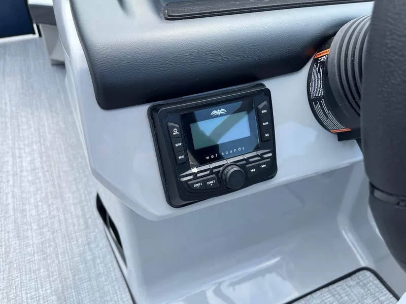 Slide: The Image of Audio control panel on 2026 Harris Cruiser 210 boat dashboard. - 6