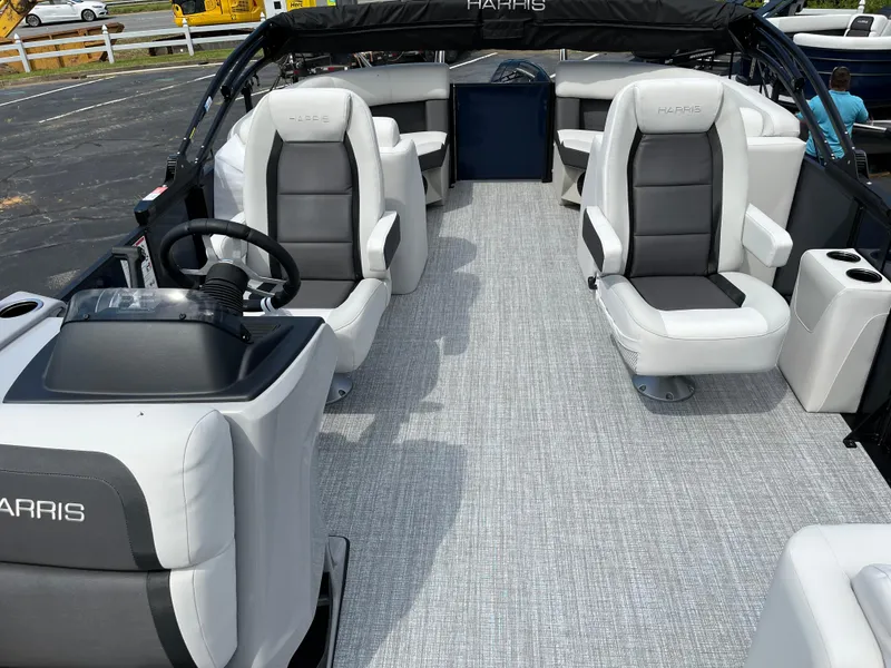 Slide: The Image of 2026 Harris Cruiser 210 interior with plush seating and modern helm. - 9