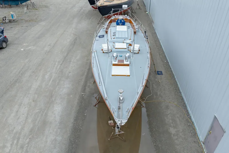 Slide: The Image of Aerial view of a 1972 Hinckley 48 yacht on dry dock. - 10