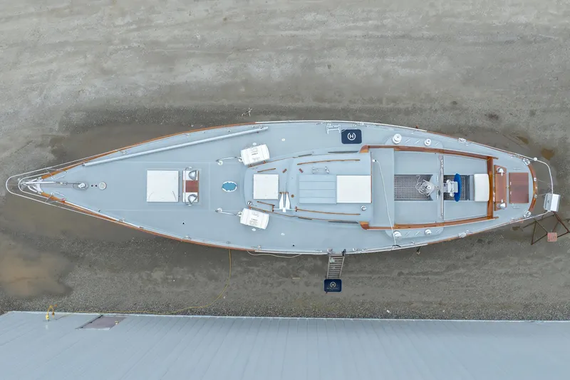 Slide: The Image of Aerial view of a 1972 Hinckley 48 yacht on dry land. - 11