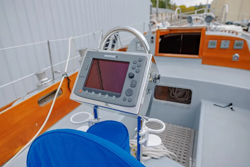Slide: The Image of Cockpit of 1972 Hinckley 48 sailboat with navigation equipment and wooden accents. - 20