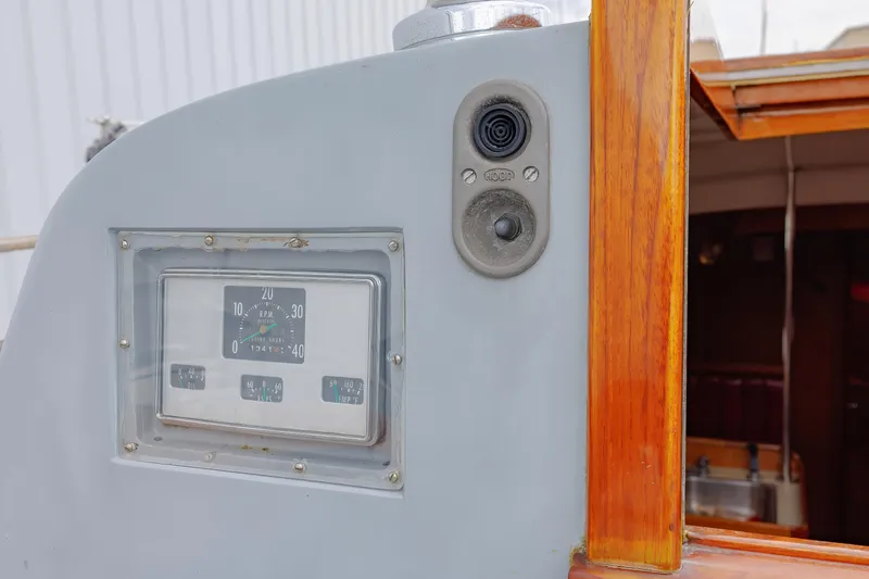 Slide: The Image of Hinckley 48 yacht dashboard with RPM gauge and wooden trim, 1972 model. - 28