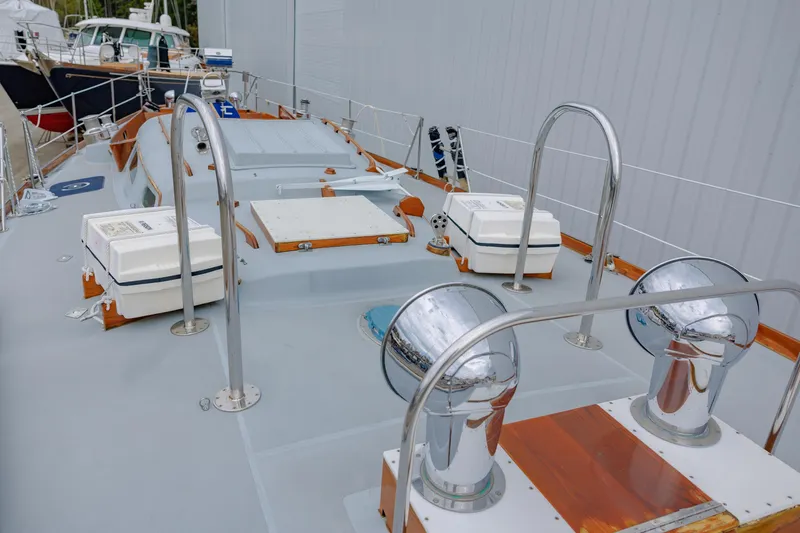 Slide: The Image of Hinckley 48 sailboat deck, 1972 model, featuring chrome fixtures and storage boxes. - 15