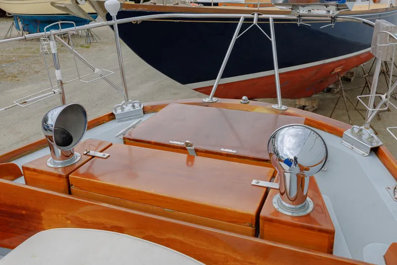 Slide: The Image of Hinckley 48 sailboat deck, 1972 model, featuring polished wood and chrome details. - 22