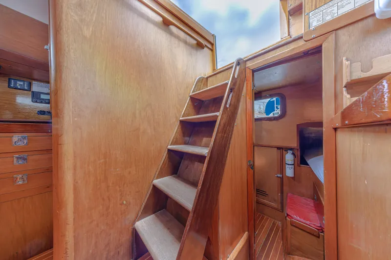 Slide: The Image of Interior of 1972 Hinckley 48 sailboat with wooden stairs and cabin view. - 34
