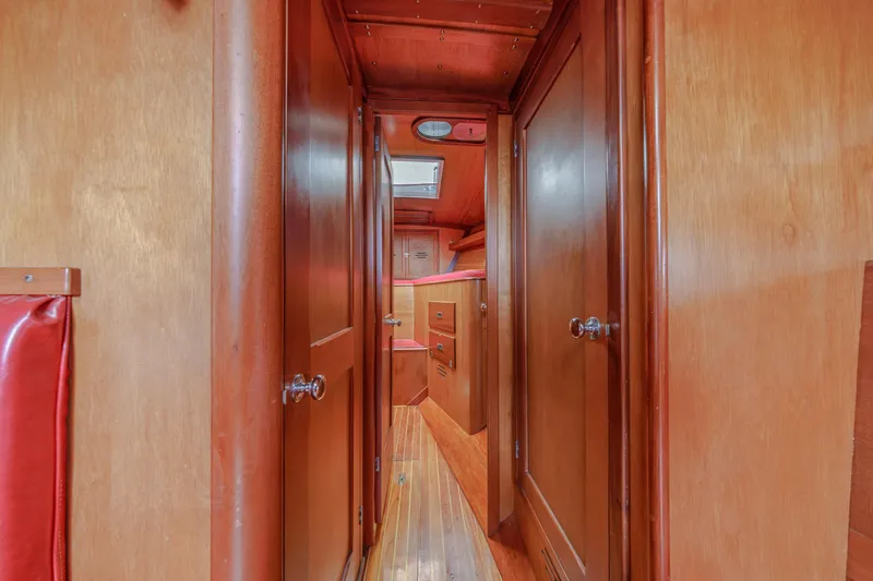 Slide: The Image of Interior of 1972 Hinckley 48 yacht with wooden paneling and cozy cabin space. - 42