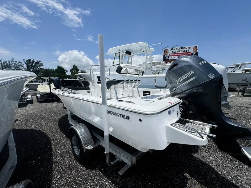 Slide: The Image of 2026 Tidewater 1910 Bay Max boat with Yamaha engine on display under clear sky. - 2