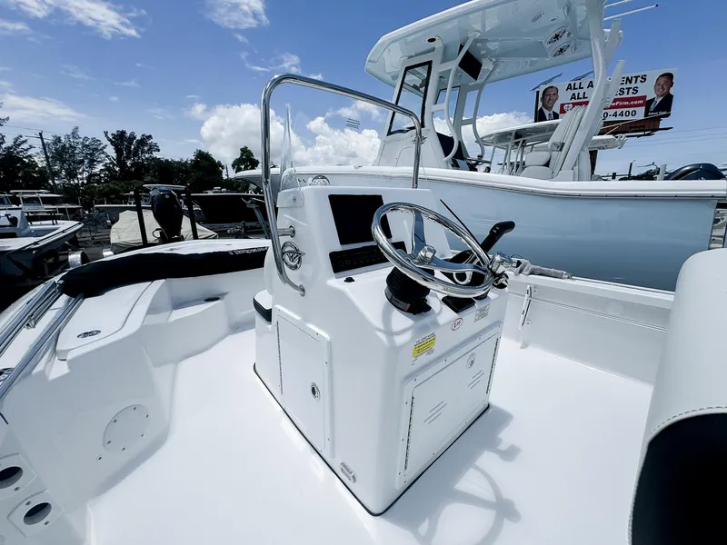 Slide: The Image of 2026 Tidewater 1910 Bay Max boat interior with steering console under clear sky. - 5