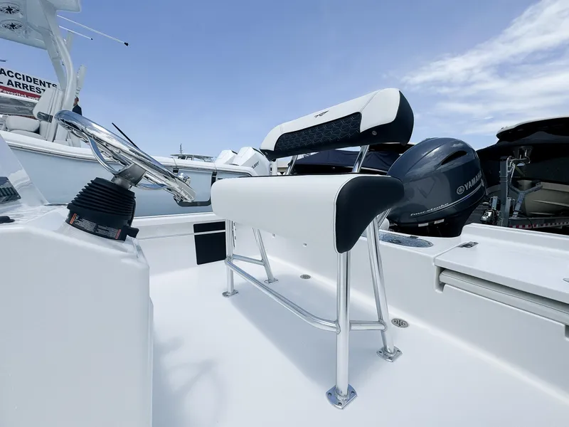 Slide: The Image of 2026 Tidewater 1910 Bay Max boat interior with steering wheel and Yamaha engine. - 6