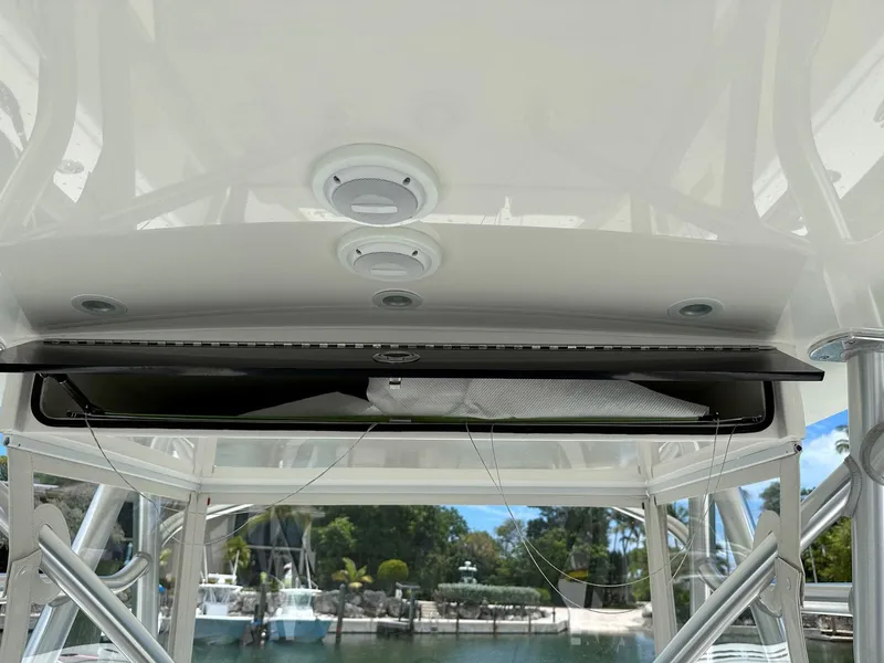 Slide: The Image of 2018 SeaVee 390Z boat interior with storage compartment and overhead lighting. - 10
