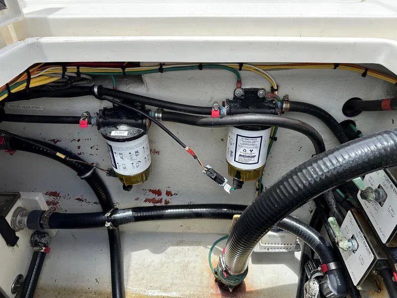 Slide: The Image of Engine compartment of a 2018 SeaVee 390Z boat, showing fuel filters and hoses. - 22