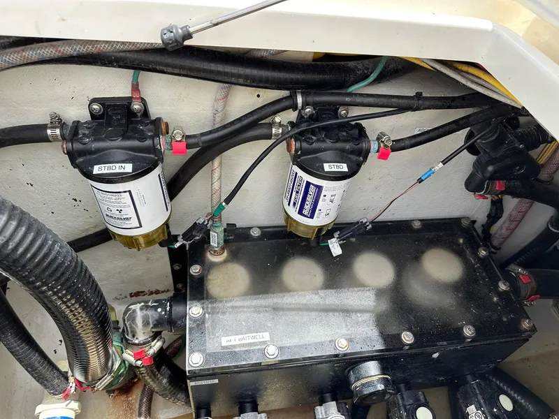 Slide: The Image of Engine compartment of a 2018 SeaVee 390Z boat showing fuel filters and wiring. - 23