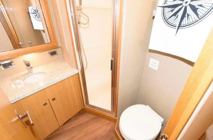 Slide: The Image of Bathroom interior of 2015 Hatteras 45 Express Sportfish with shower and vanity. - 10