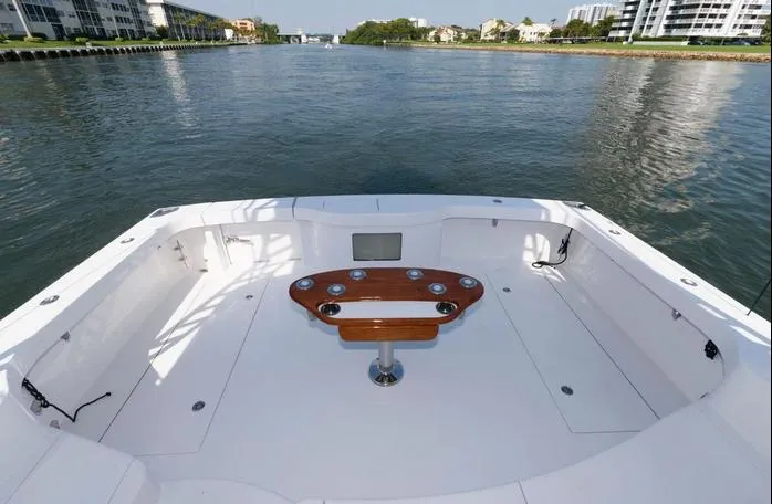 Slide: The Image of 2015 Hatteras 45 Express Sportfish boat deck with scenic waterway view. - 25