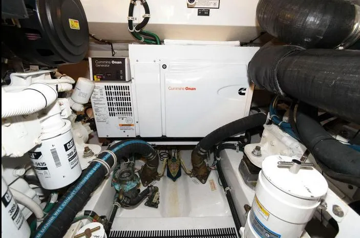 Slide: The Image of Engine room of 2015 Hatteras 45 Express Sportfish with Cummins Onan generator. - 32