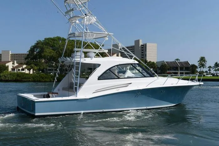 Slide: The Image of 2015 Hatteras 45 Express Sportfish boat cruising on a sunny day. - 34