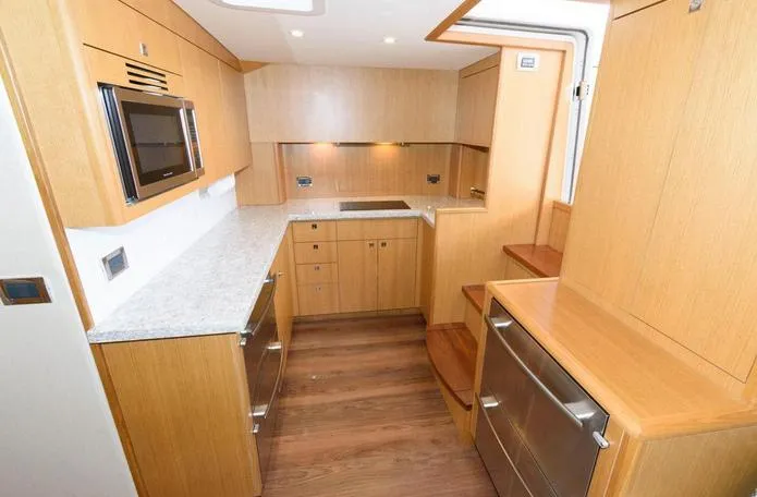 Slide: The Image of Interior of 2015 Hatteras 45 Express Sportfish yacht with modern kitchen design. - 6
