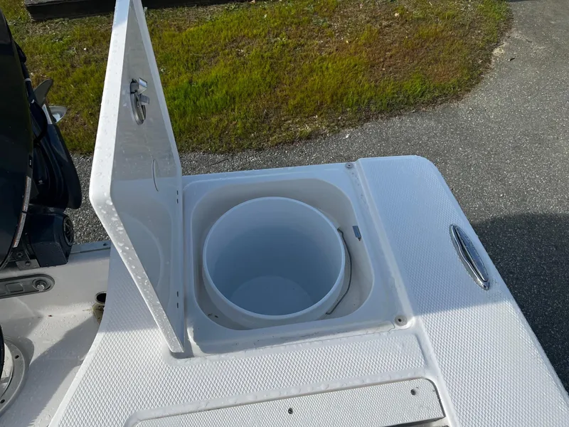 Slide: The Image of Open storage compartment on 2025 Robalo 206 Cayman boat deck. - 16