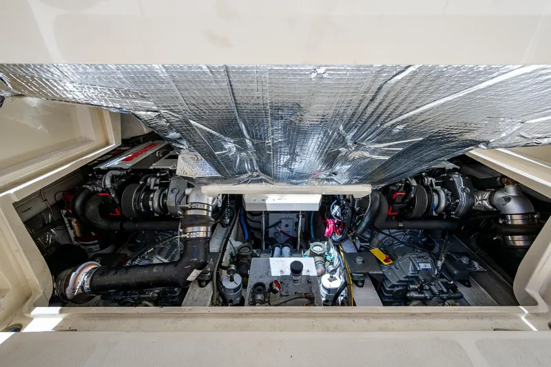 Slide: The Image of Engine compartment of a 2016 Hinckley Talaria 34 boat, showcasing mechanical components. - 16