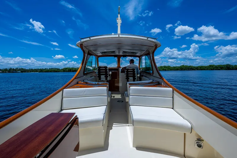 Slide: The Image of 2016 Hinckley Talaria 34 yacht cruising on a sunny day with clear blue skies. - 3