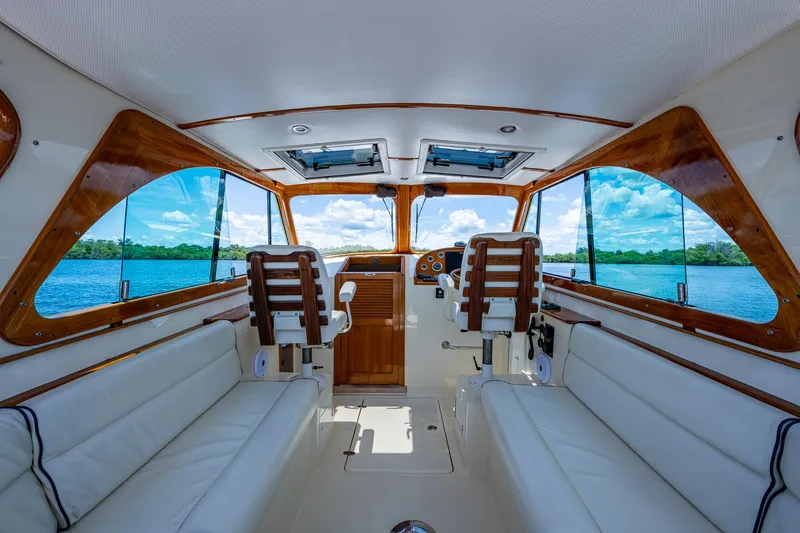 Slide: The Image of Interior of 2016 Hinckley Talaria 34 yacht with luxurious seating and scenic water view. - 4
