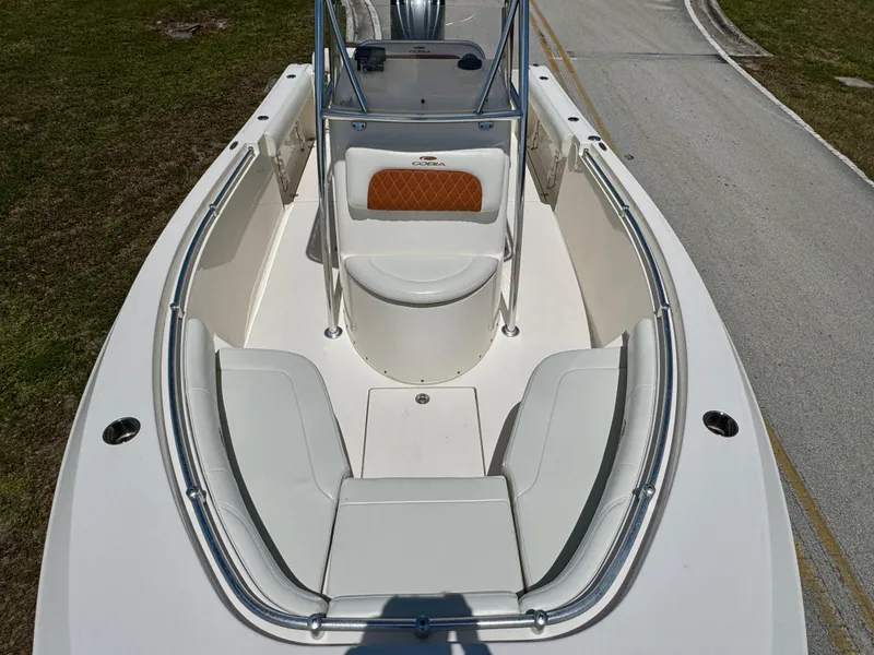 Slide: The Image of 2022 Cobia 237 Center Console boat with spacious seating and sleek design. - 10