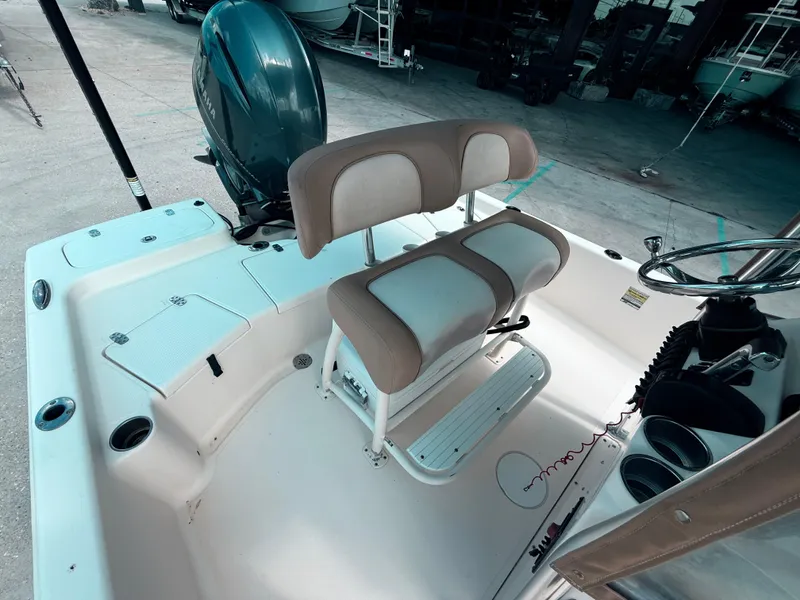 Slide: The Image of 2014 Scout WINYAH BAY 221 boat interior with seating and Yamaha engine. - 13